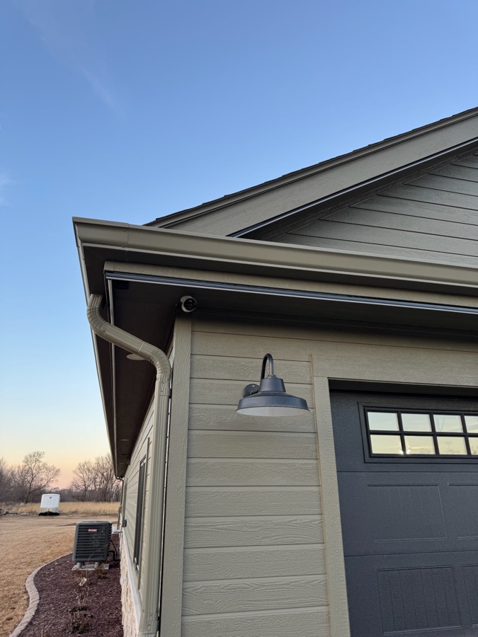 Close-up of the roofline lighting fixture during the day, fully hidden along the trim